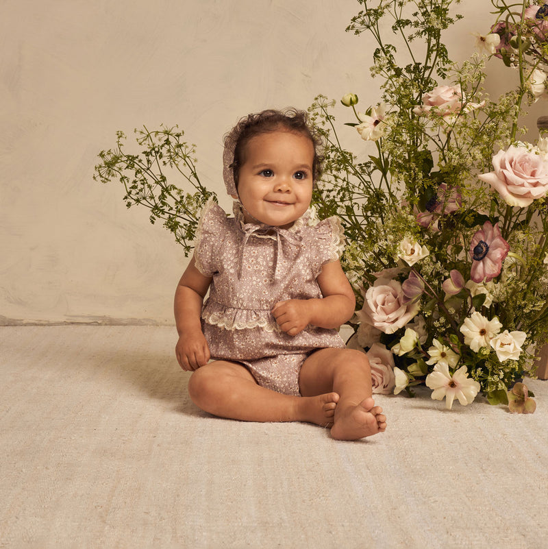 baby wearing Noralee Alice Romper - Lavender Bloom