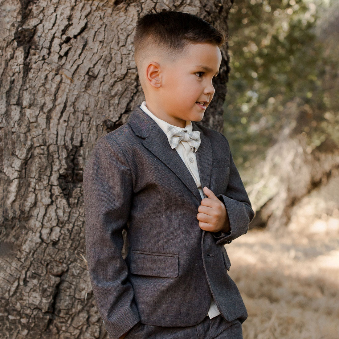 Little boy wearing Noralee Bow Tie - Autumn Plaid - Black / Natural