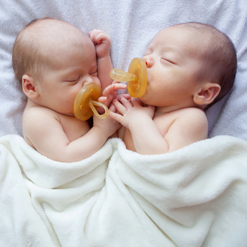 Babies using Natursutten Natural Rubber Original Pacifier - Rounded