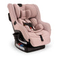 Child rides in Nuna RAVA 2024 Convertible Car Seat - Thistle