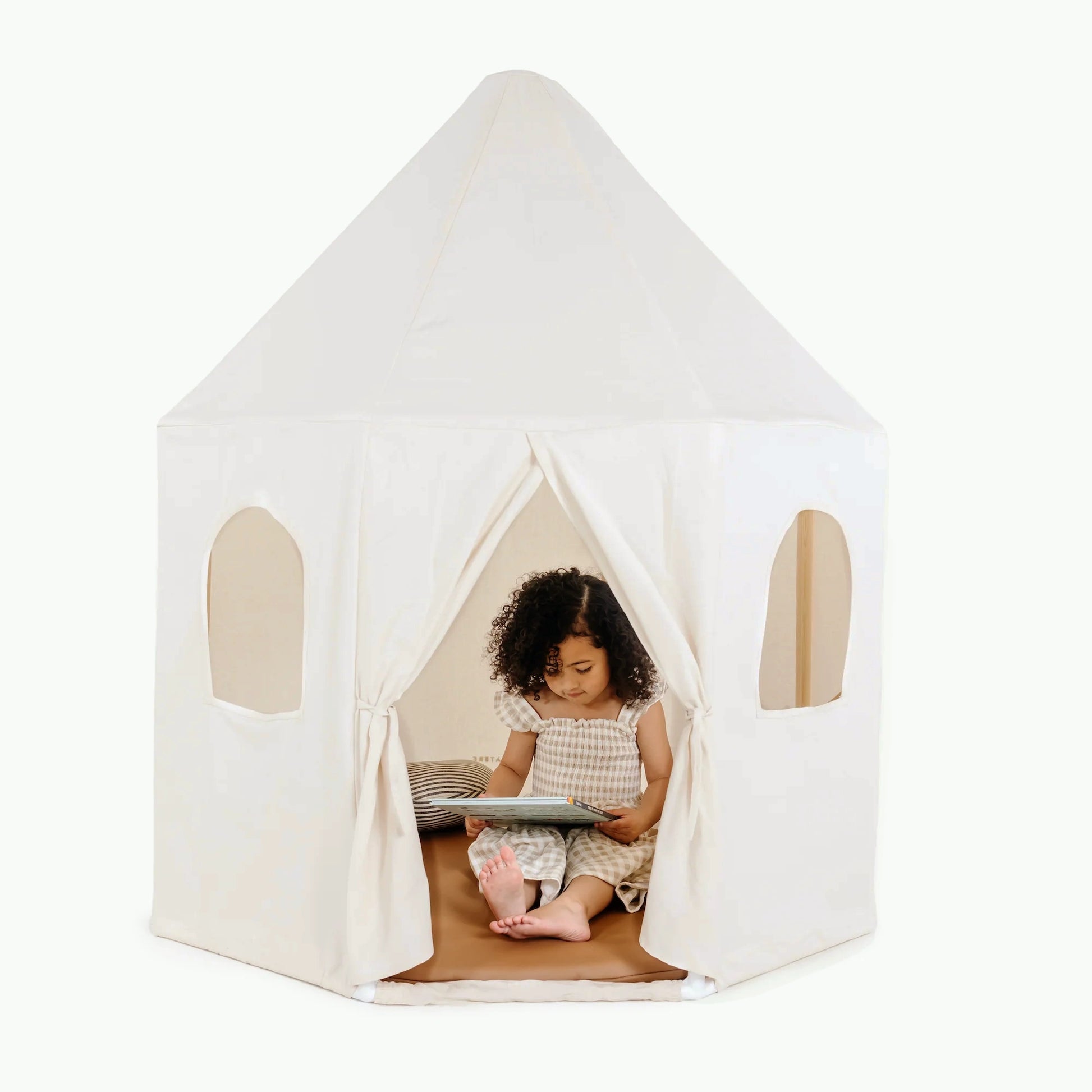 Little girl reads a book inside Gathre Play Tent - Ivory