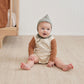 Baby wearing Quincy Mae Long Sleeve Romper - Dino - Natural