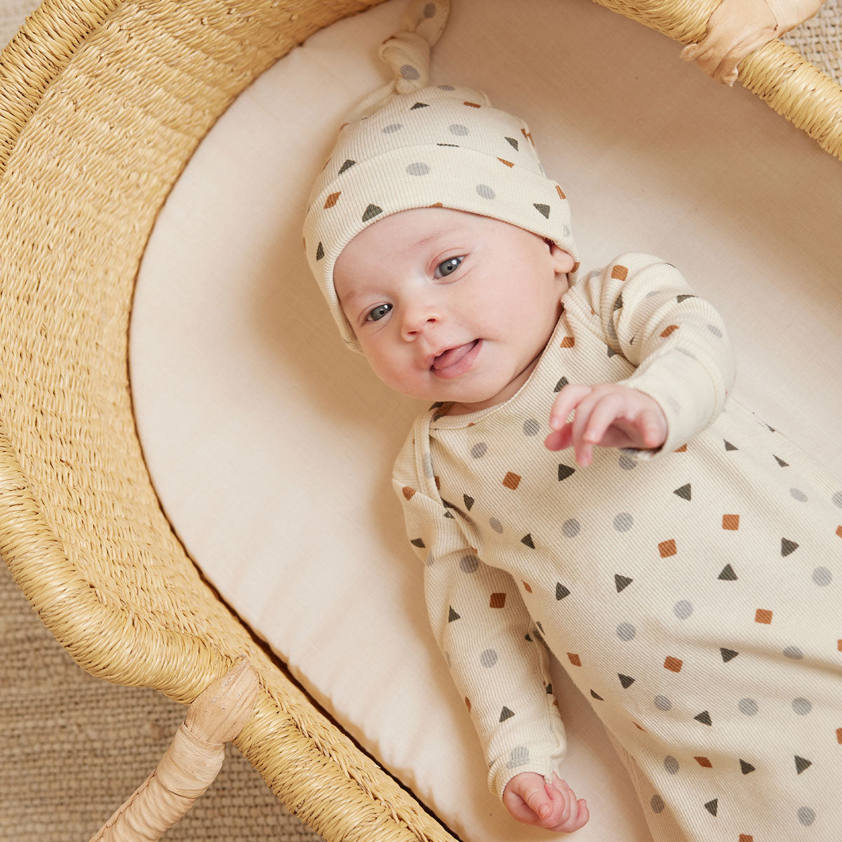 Baby wearing Quincy Mae Knotted Baby Gown & Hat Set - Geo - Natural