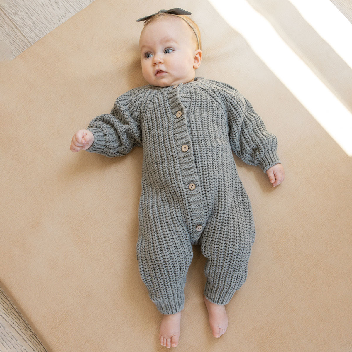 Baby wearing Quincy Mae Chunky Knit Jumpsuit - Basil