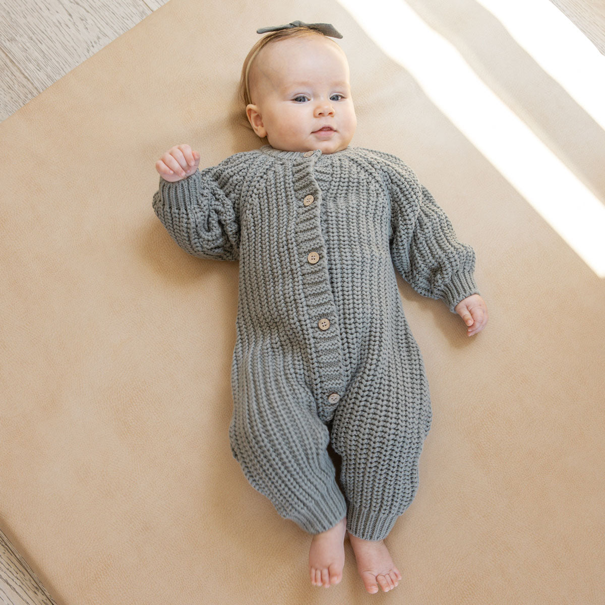 Baby wearing Quincy Mae Chunky Knit Jumpsuit - Basil