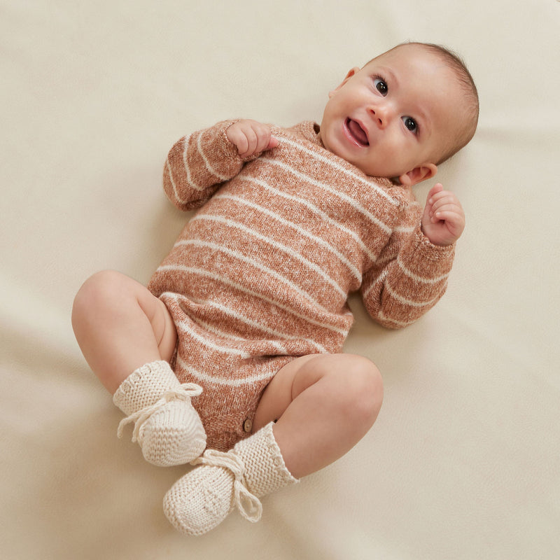 Baby wearing Quincy Mae Riggens Romper - Cinnamon Stripe - Heathered