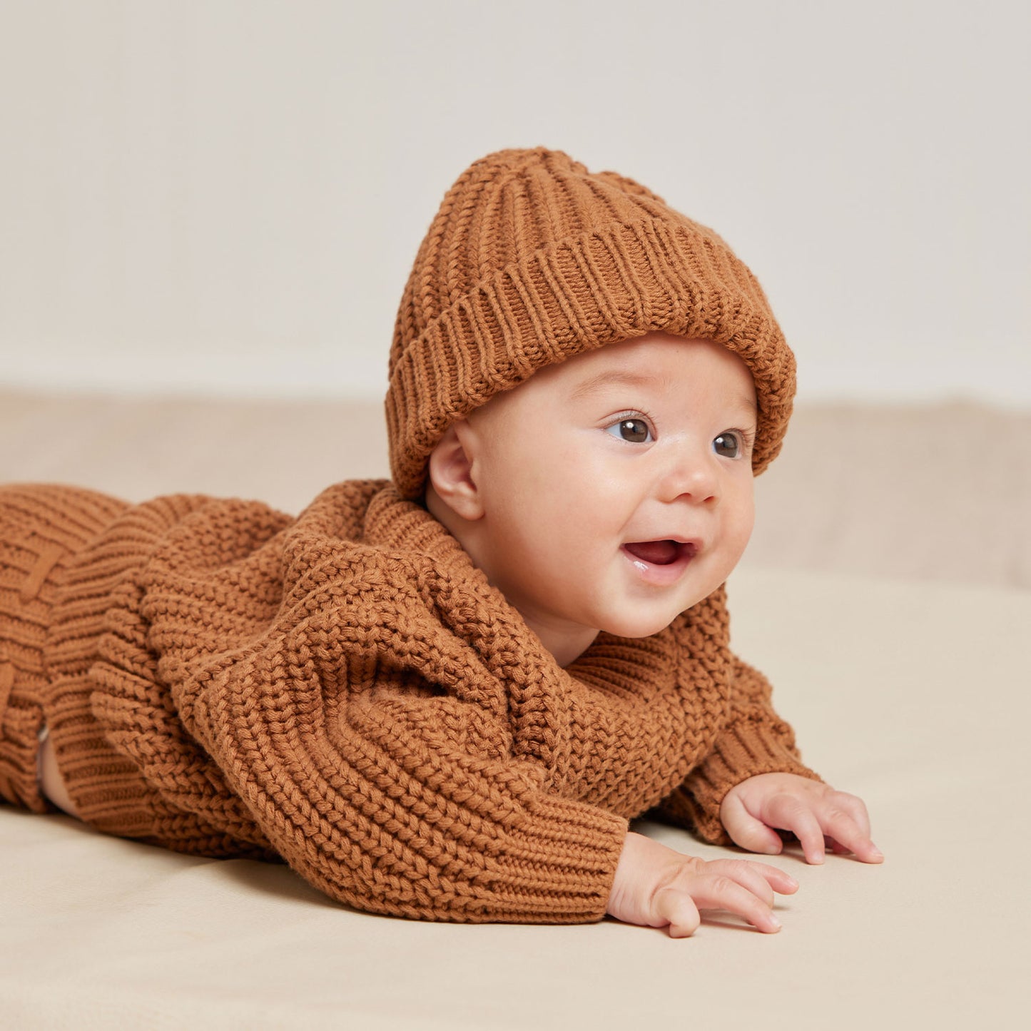 Baby wearing Quincy Mae Knit Tie Bloomer - Cinnamon