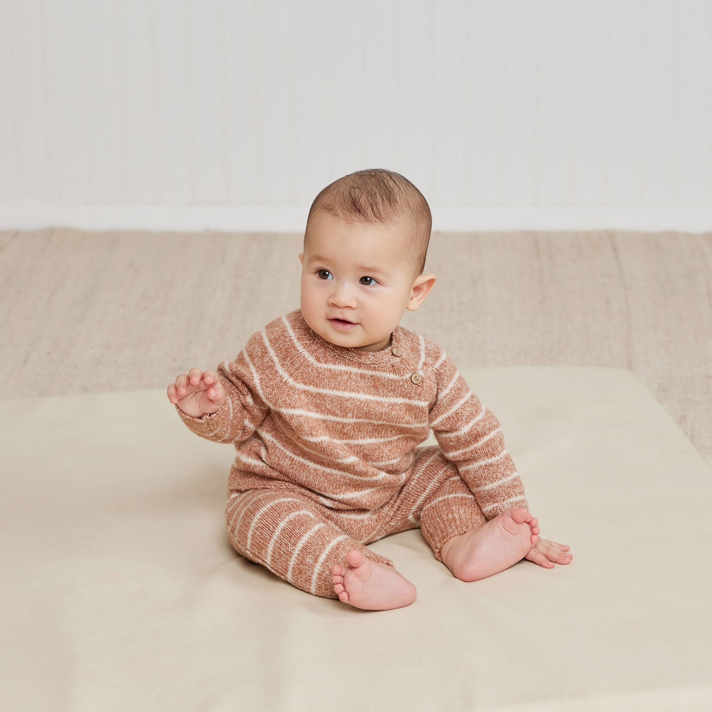 Baby wearing Quincy Mae Ace Knit Sweater - Cinnamon Stripe - Heathered