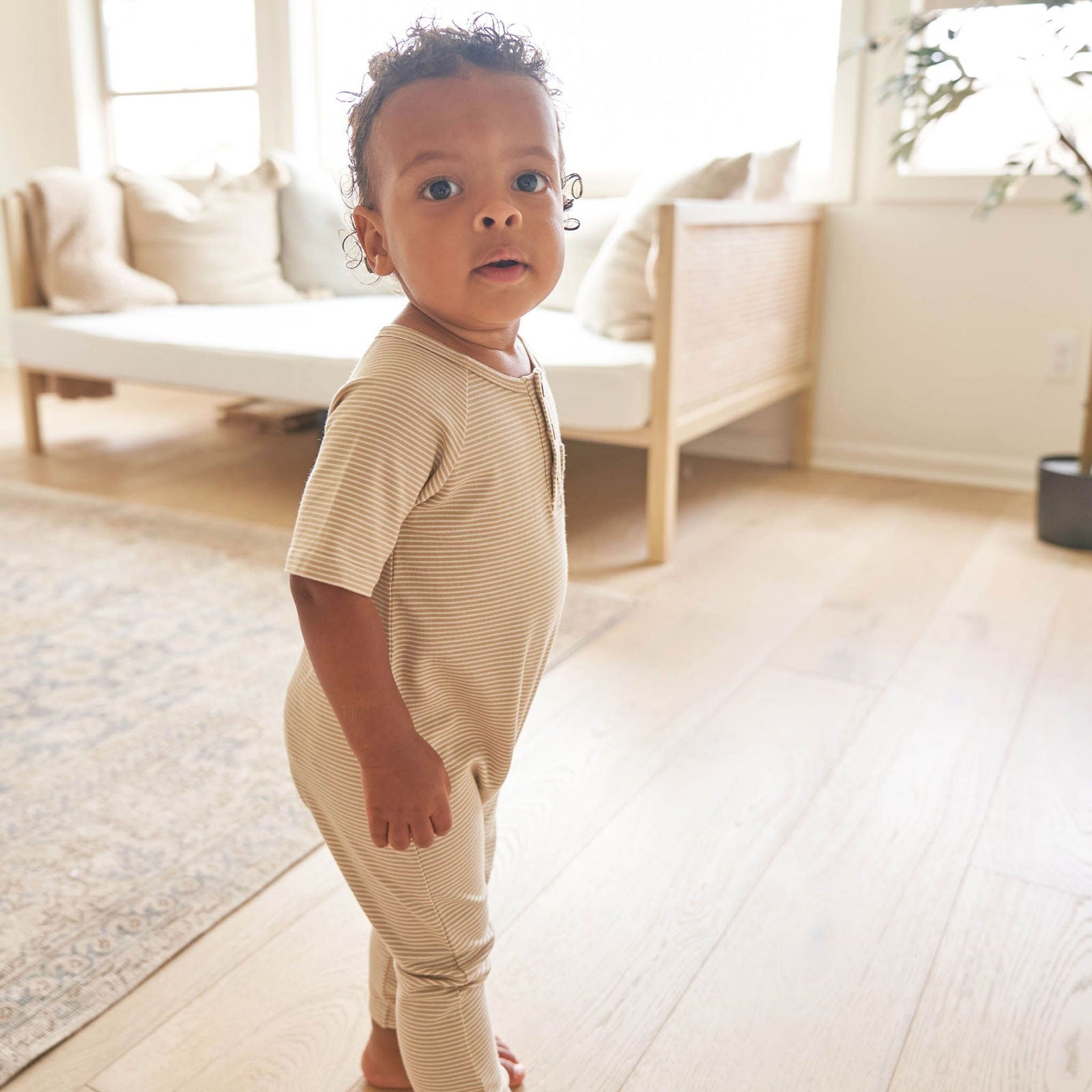 Toddler wearing Quincy Mae Short Sleeve Jumpsuit - Latte Micro Stripe