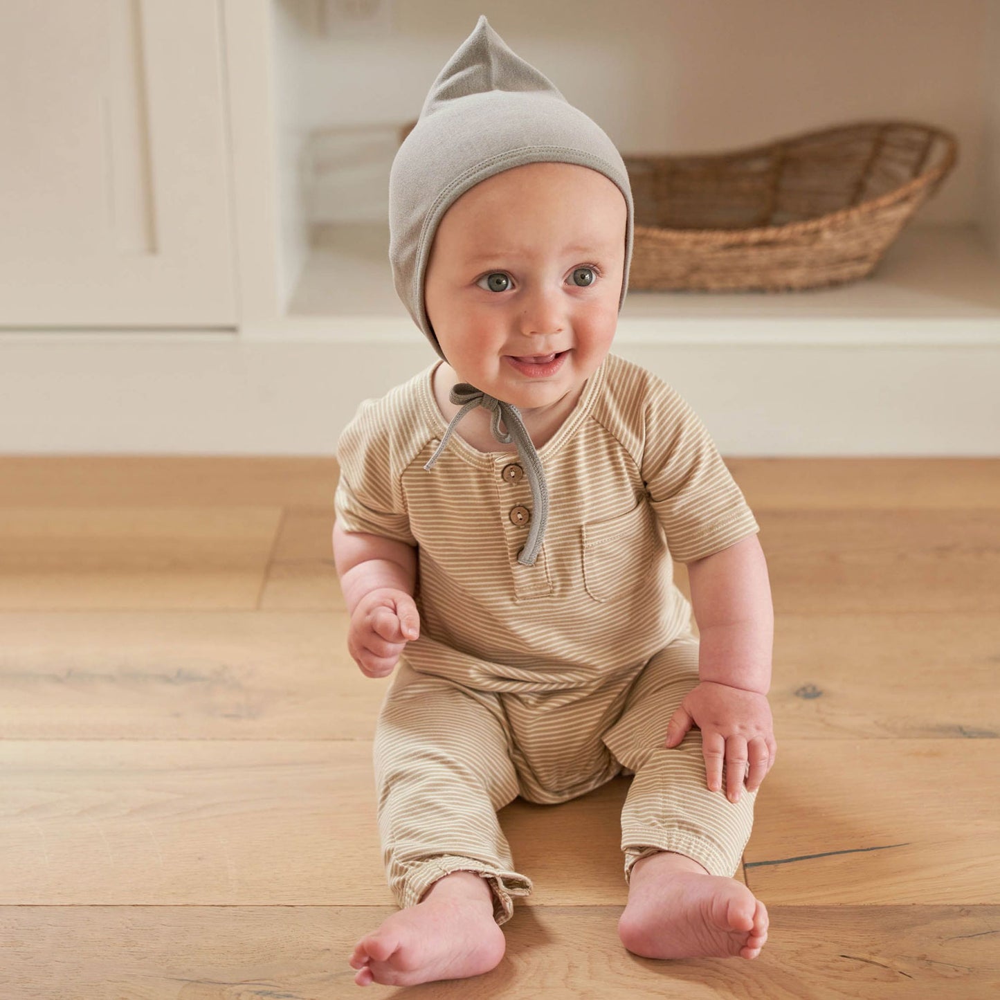 Baby wearing Quincy Mae Short Sleeve Jumpsuit - Latte Micro Stripe