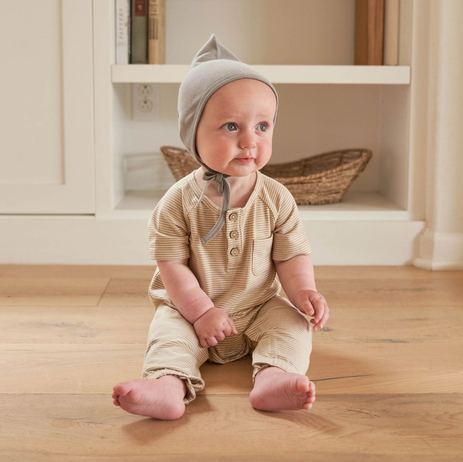 Baby wearing Quincy Mae Short Sleeve Jumpsuit - Latte Micro Stripe