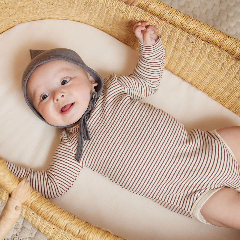 Baby wearing Quincy Mae Ribbed Long Sleeve Bodysuit - Plum Stripe