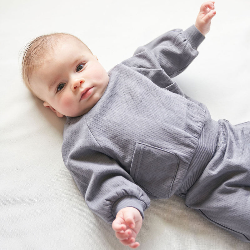 Baby wearing Quincy Mae Pointelle Pocket Sweatshirt - Navy