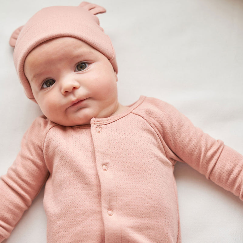 Baby wearing Quincy Mae Pointelle Baby Bear Beanie - Rose