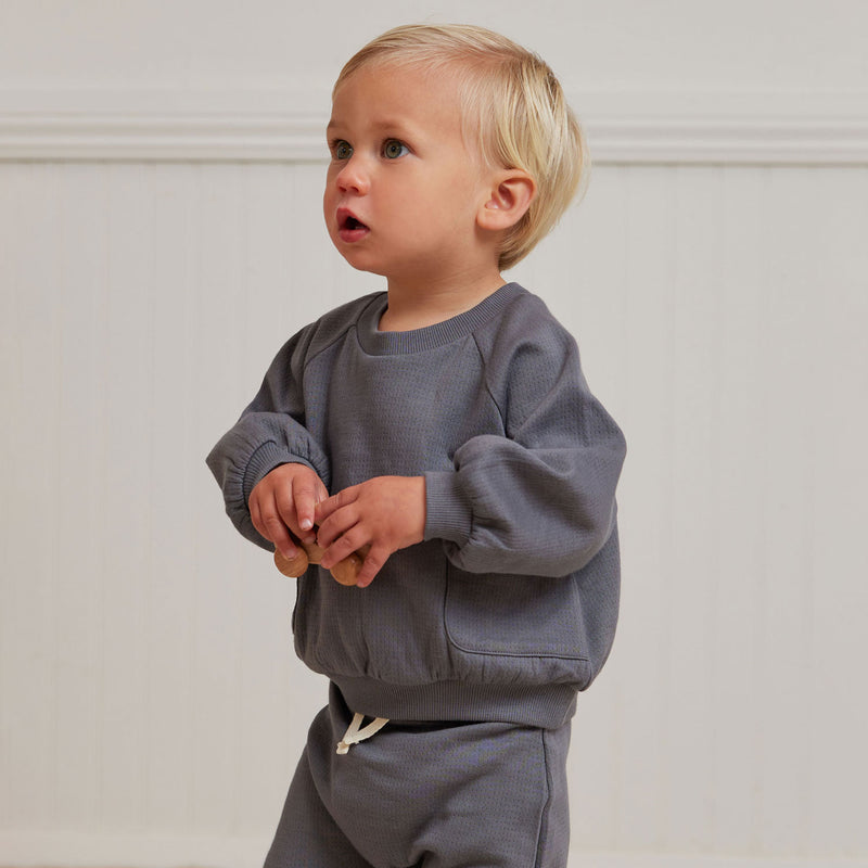Little boy wearing Quincy Mae Pointelle Pocket Sweatshirt - Navy