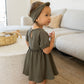 Little girl wearing Quincy Mae Annie Dress - Forest