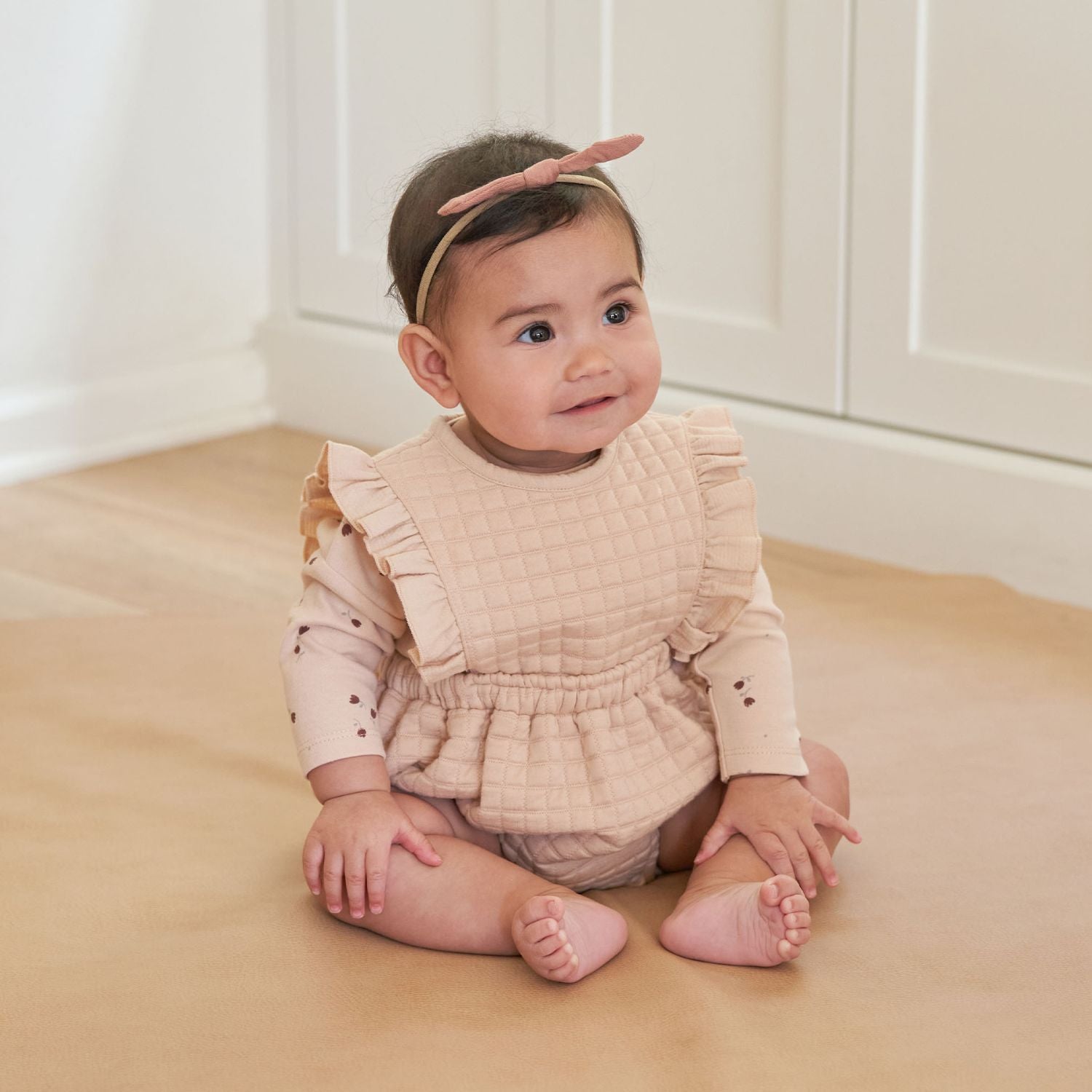 Little girl wearing Quincy Mae Ruffle Bubble Romper - Shell
