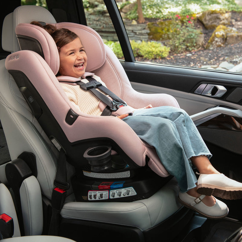 Child rides in Nuna RAVA 2024 Convertible Car Seat