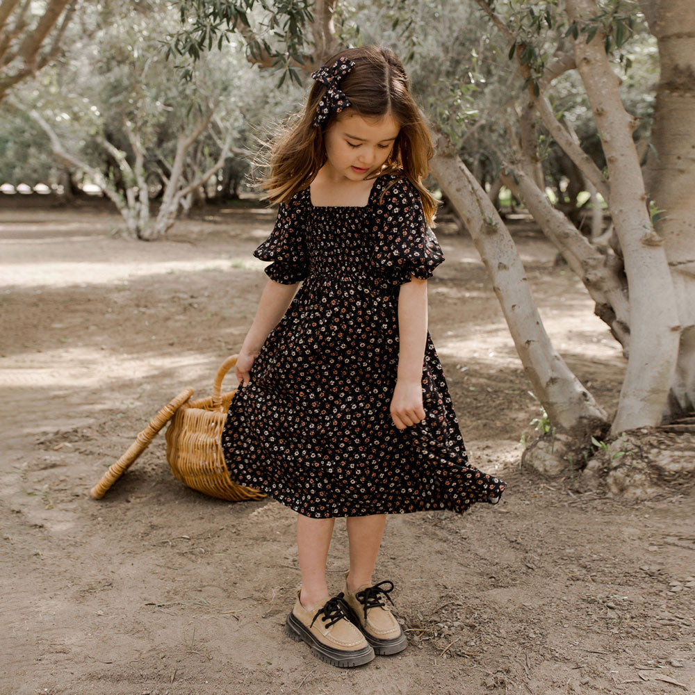 Little girl wearing Rylee and Cru Adelaide Dress - Dark Floral - Black