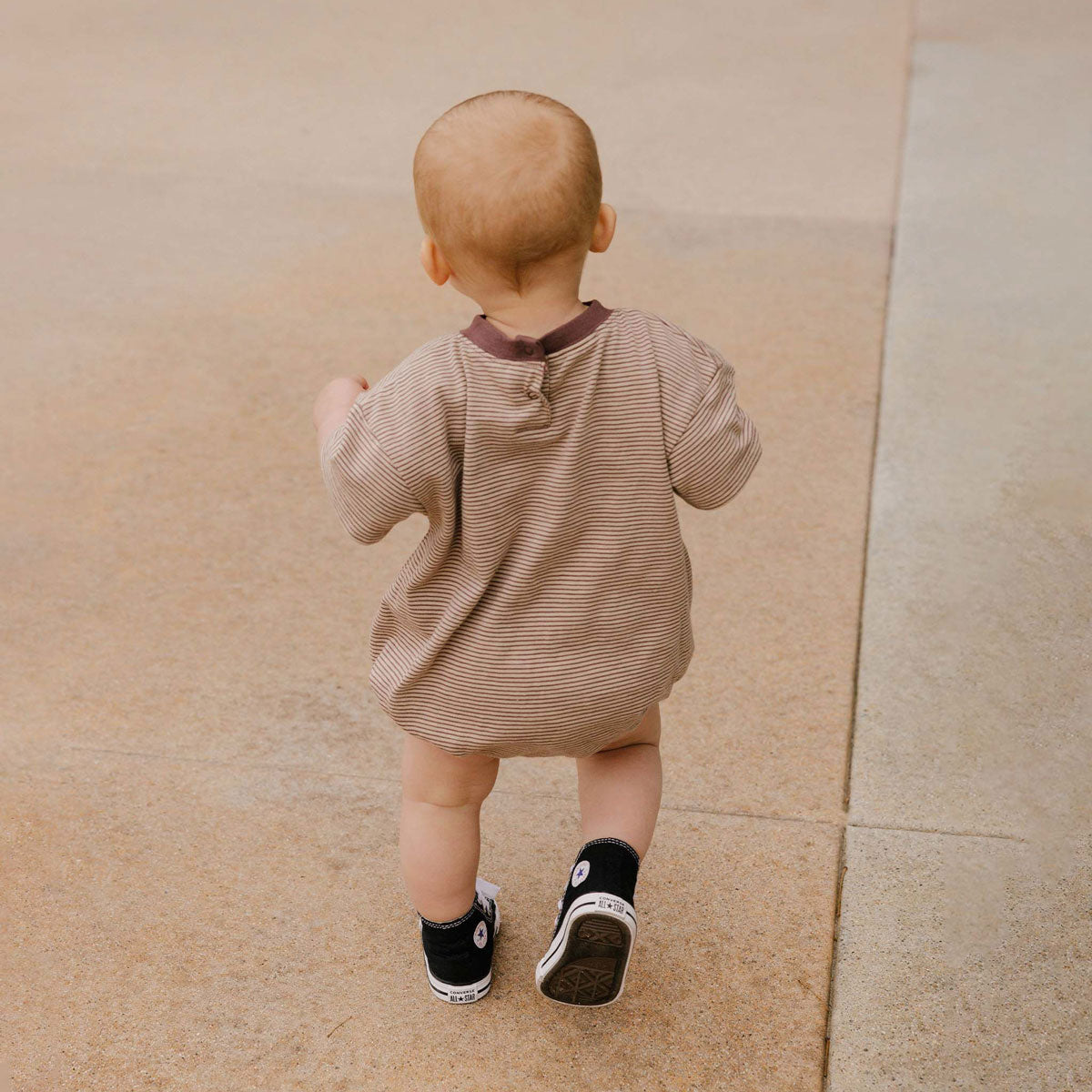 Toddler wearing Rylee and Cru Relaxed Short Sleeve Bubble Romper - Micro Stripe - Plum / Sand Stripe