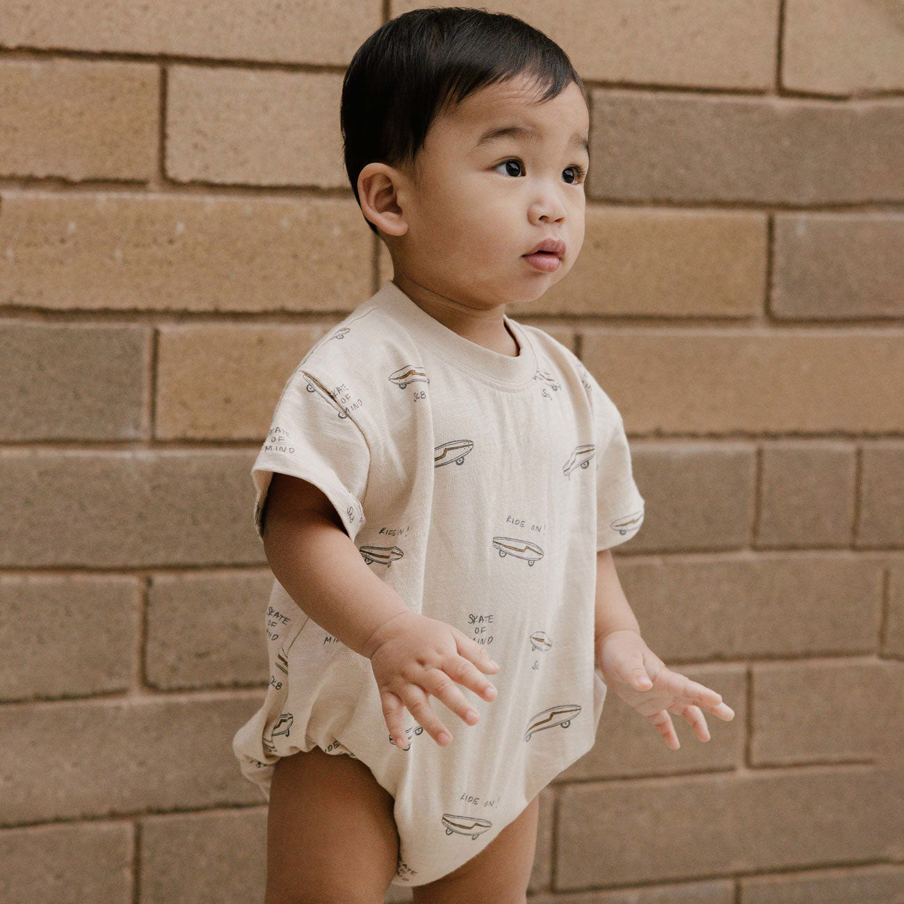 Toddler wearing Rylee and Cru Relaxed Short Sleeve Bubble Romper - Skate - Natural