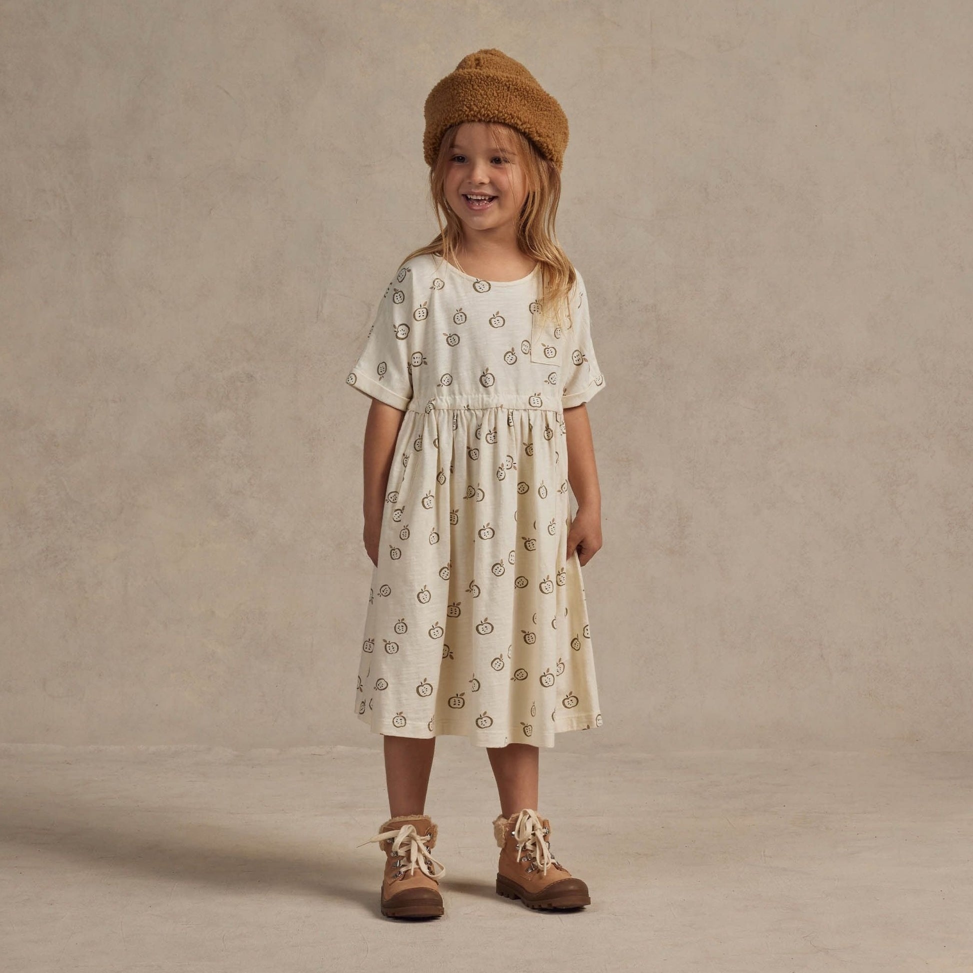 Little girl wearing Rylee and Cru Kat T-Shirt Dress - Apples - Ivory