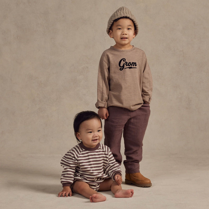 Boy wearing Rylee and Cru Long Sleeve Paneled Tee - Grom - Plum / Sand Stripe standing next to baby