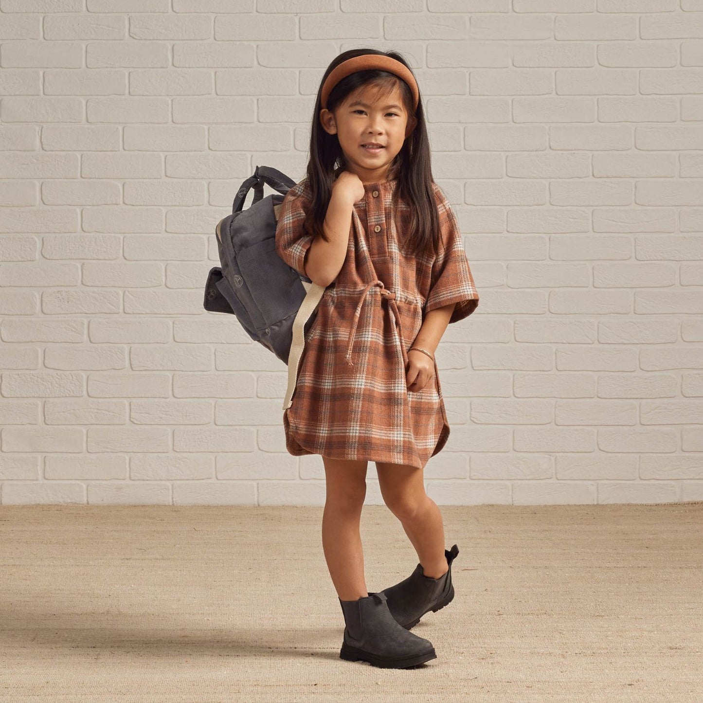 Little girl wearing Rylee and Cru Mini Backpack - Peace Embroidery - Slate