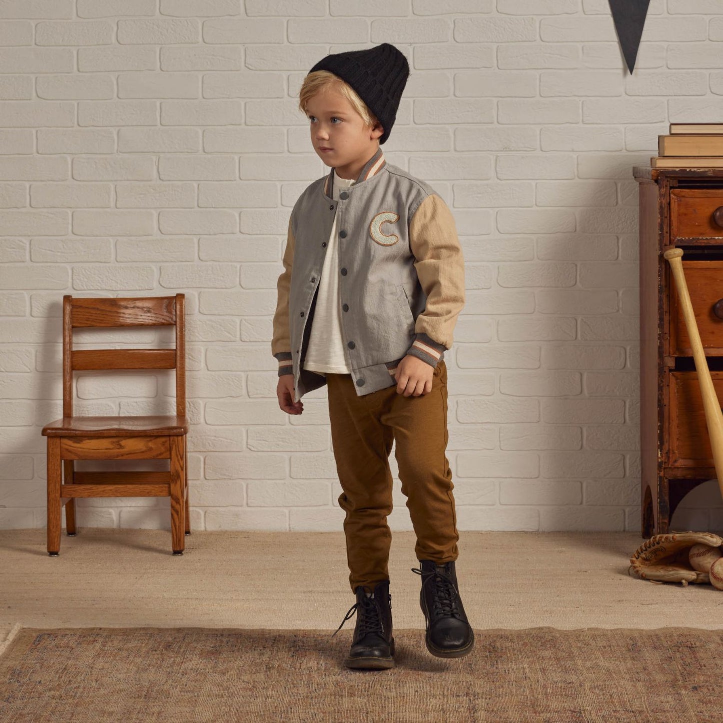Boy wearing Rylee and Cru Varsity Jacket - Ivory / Slate