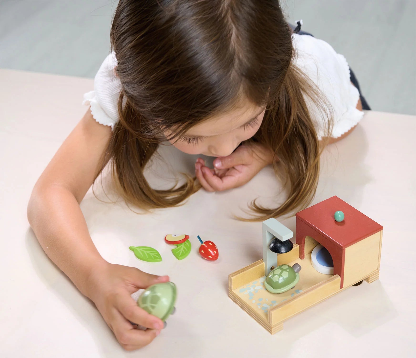 Girl plays with Tender Leaf Toys Tortoise Pet Set