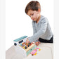 Little boy plays with Tender Leaf Toys General Stores Till