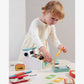 Little girl plays with Tender Leaf Toys General Stores Till