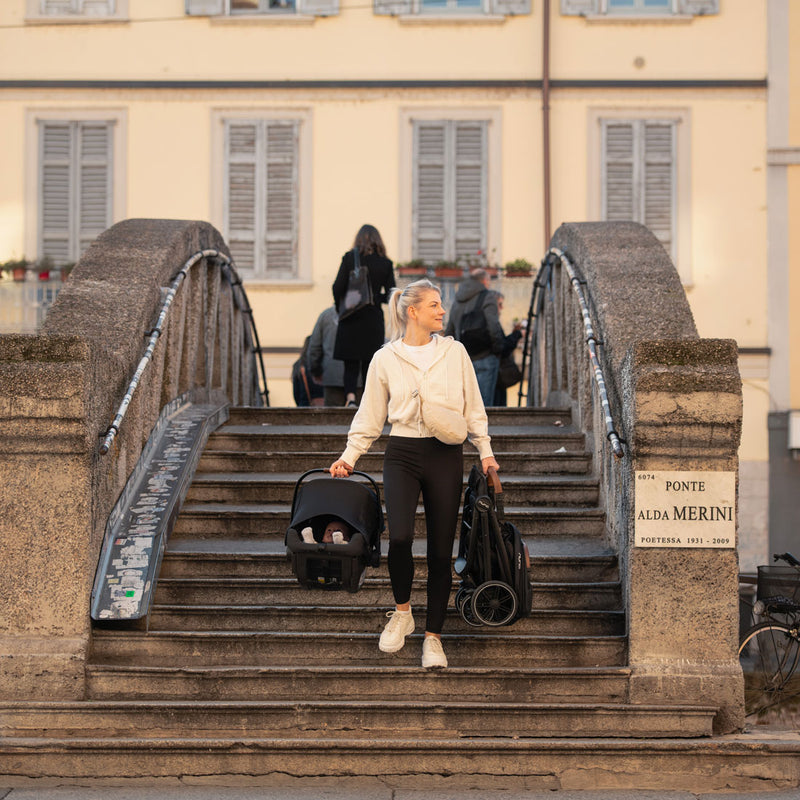 Mom explores Europe while carrying Nuna TRVL LX Stoller and PIPA Urbn Car Seat Travel System - Caviar