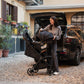 Mom using Nuna TRVL LX Stoller and PIPA Urbn Car Seat Travel System - Caviar