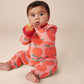 Baby wearing Tea Collection Ruffle Shoulder Baby Romper - Normandy Apples