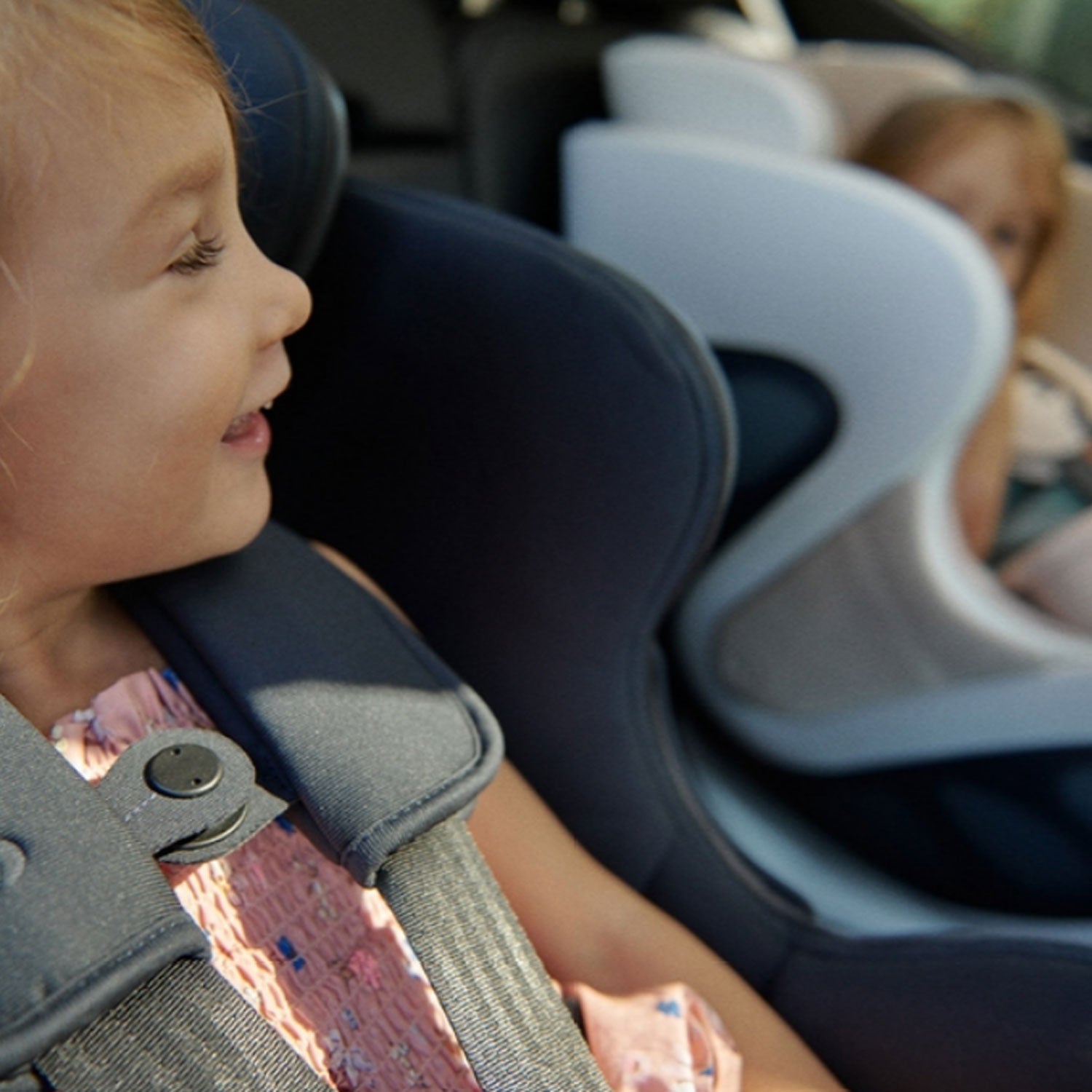 Children in babyark Convertible Car Seat + Base
