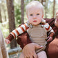 Baby wearing goumikids Long Sleeve Bodysuit - Trail Mix