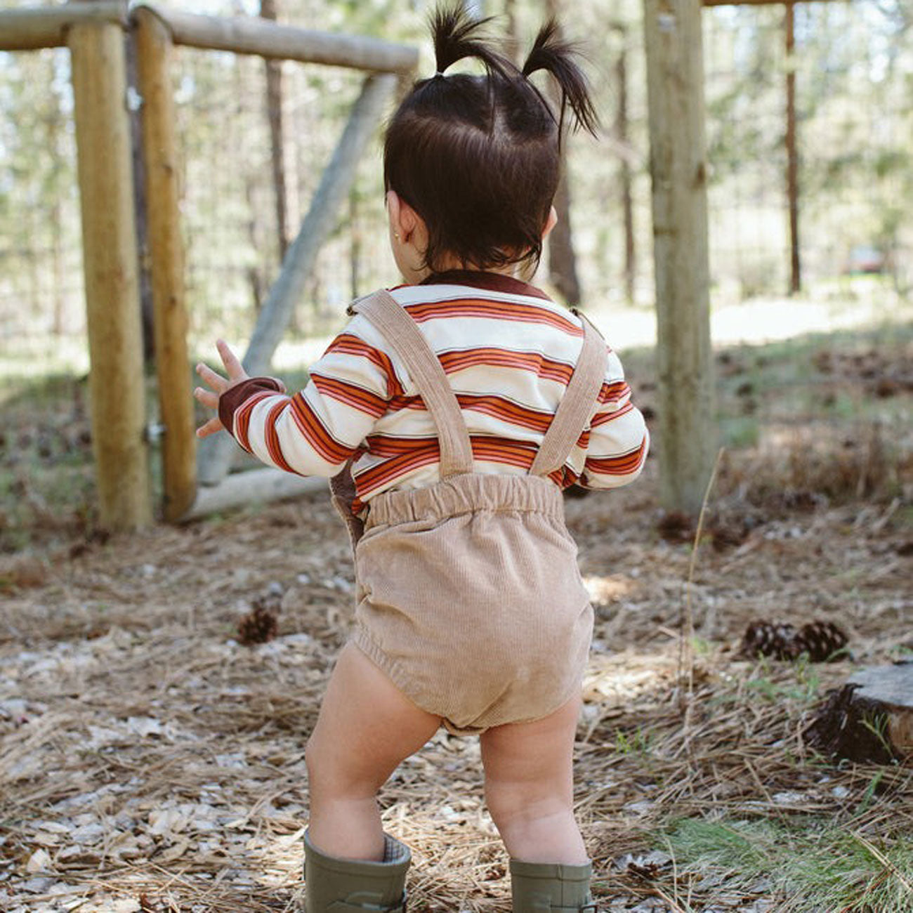 Baby wearing goumikids Long Sleeve Bodysuit - Trail Mix
