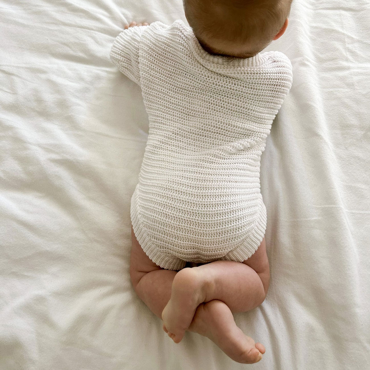 Baby wearing Oat and Co Chunky Knit Onesie - Dove