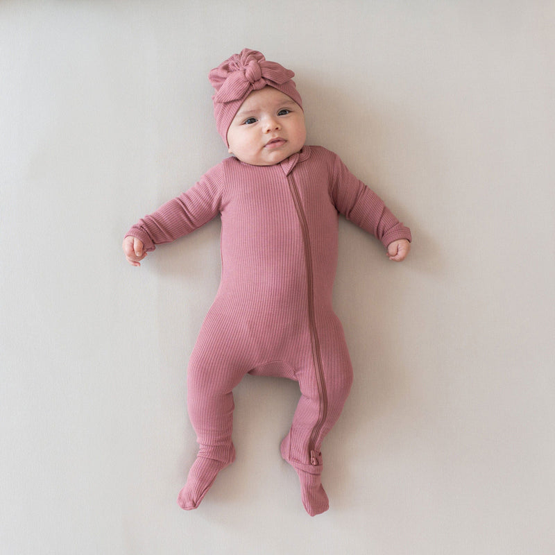Baby wearing Kyte BABY Ribbed Zipper Footie - Dusty Rose