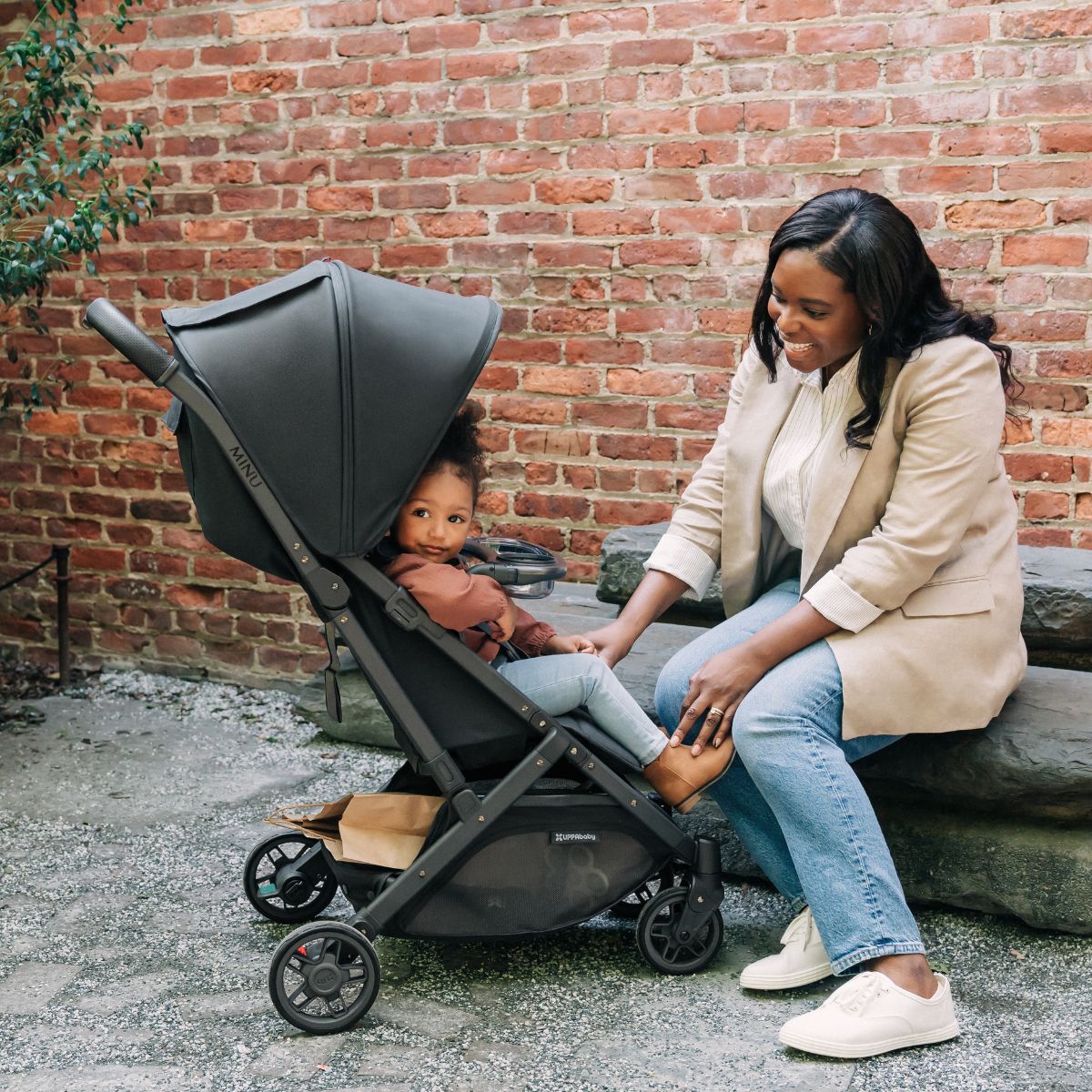 Woman talks to child in UPPAbaby MINU V2 Stroller - Jake