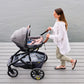 Woman pushes stroller with Veer Switchback &Roll Frame or &Jog Frame Leather Grips