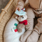 Baby Holding Itzy Ritzy Holiday Itzy Pal Infant Toy - Jolly the Reindeer