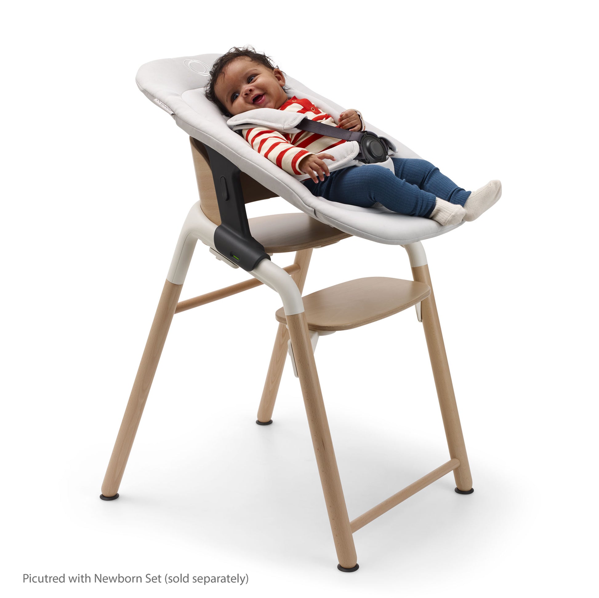 Baby in Bugaboo Giraffe High Chair Complete - Neutral Wood / White with Newborn Set