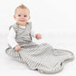 Toddler sitting up wearing Woolino 4 Season Ultimate Baby Sleep Bag - Merino Wool / Organic Cotton - Earth