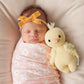 Newborn baby sleeping next to Cuddle and Kind Baby Duckling - Yellow