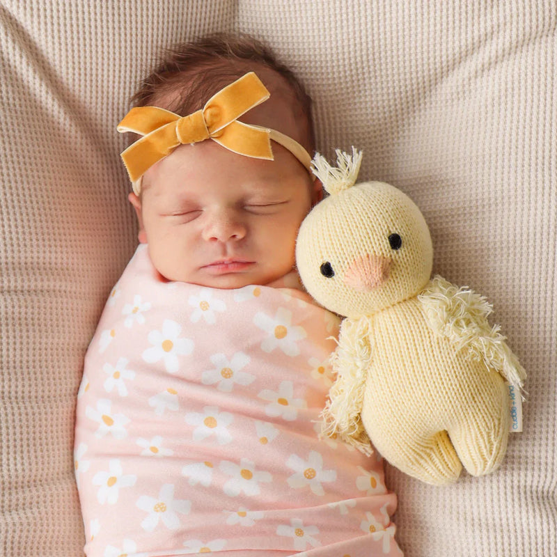 Newborn baby sleeping next to Cuddle and Kind Baby Duckling - Yellow