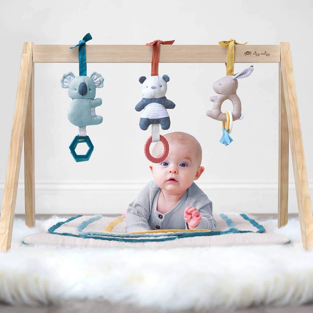 Baby on Itzy Ritzy Ritzy Activity Gym with Toys - Bitzy Bespoke