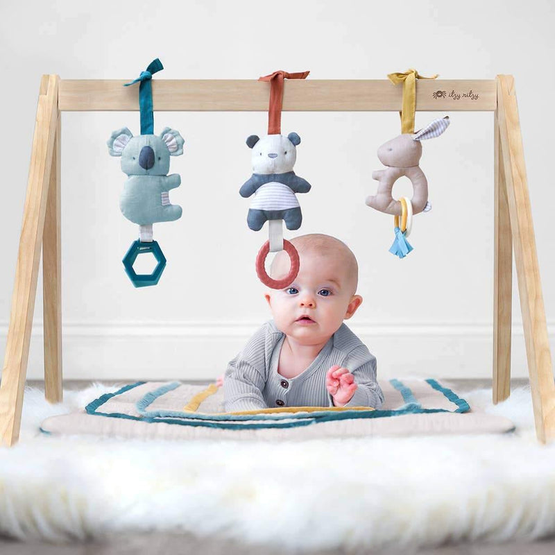 Baby on Itzy Ritzy Ritzy Activity Gym with Toys - Bitzy Bespoke