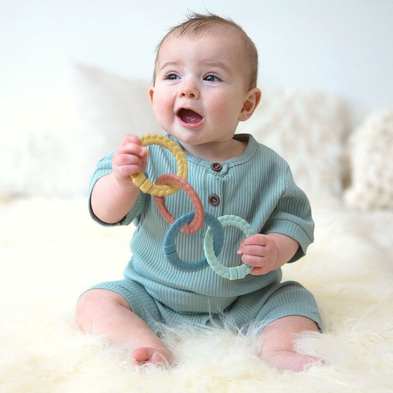 Baby Playing with Itzy Ritzy Ritzy Rings Linking Ring Set - Bitzy Bespoke